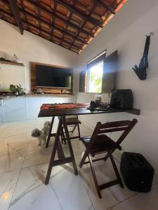 Et tv og/eller underholdning på Jardim encantado hospedagens