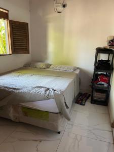 En eller flere senge i et værelse på Jardim encantado hospedagens