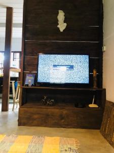 a television sitting on top of a wooden staircase at Casa Praia in Palhoça