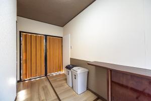 a laundry room with a washer and dryer at FUJIMI Place in Yamanashi