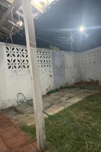 a pole in the middle of a room with a wall at Casa Caponga in Cascavel