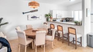 a kitchen and dining room with a table and chairs at 2 BDM, 2 Bath - Bimini Bay Resort in Bailey Town