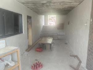 a room being remodeled with a bench in a room at The Ambience in Maseru