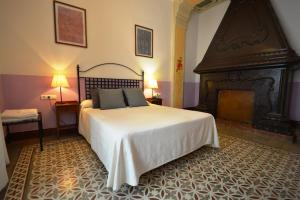 Ein Bett oder Betten in einem Zimmer der Unterkunft Hotel Casa de los Azulejos