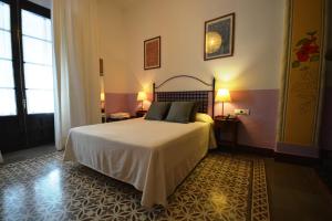 Ein Bett oder Betten in einem Zimmer der Unterkunft Hotel Casa de los Azulejos