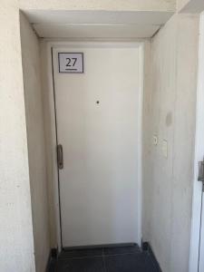 a room with a door with the number on it at Escobar Centro II in Belén de Escobar