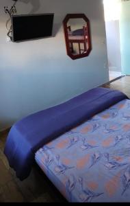 En eller flere senge i et værelse på Kitnet em Cabo Frio 02