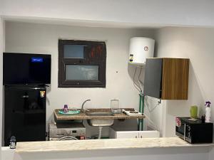 a room with a kitchen with a sink and a counter at One Bedroom Apartment - Port Said Sea View Chalet in Port Said