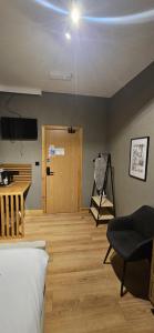 a room with a bed and a desk and a television at Amber Single Room17 Self Check-In Accommodation in Hull