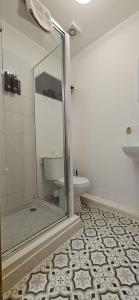 a bathroom with a glass shower with a toilet at Amber Single Room17 Self Check-In Accommodation in Hull
