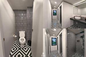 een badkamer met zwart-witte tegelvloer en een toilet bij The Rich Cafe & Hostel in Pattaya South