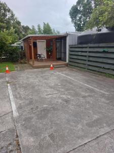 a parking lot with orange cones in front of a house at Rural in the city in Palmerston North