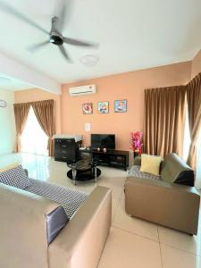 a living room with a couch and a ceiling fan at 1091 LUX Conner in Port Dickson