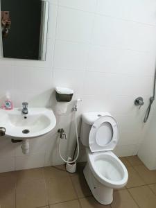 a bathroom with a toilet and a sink at 1091 LUX Conner in Port Dickson +15 photos