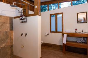 a bathroom with a toilet and a sink at Bhoga Forest 