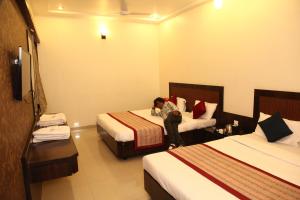 Katil atau katil-katil dalam bilik di Hotel Sai Ramanand