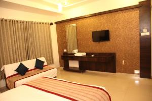 Katil atau katil-katil dalam bilik di Hotel Sai Ramanand