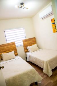 Giường trong phòng chung tại Casa Victoria Totalmente Nueva +43 ảnh