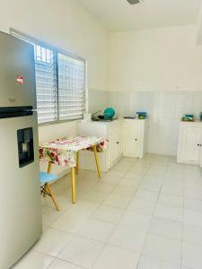 a kitchen with a table in the middle of a room at Casa Ich in Valladolid