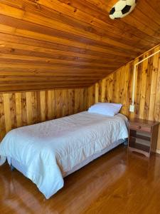 En eller flere senge i et værelse på Casa amplia Queule