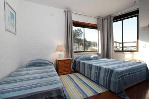 En eller flere senge i et værelse på Sítio Do Louro Villa + 67 billeder