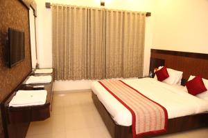 Katil atau katil-katil dalam bilik di Hotel Sai Ramanand