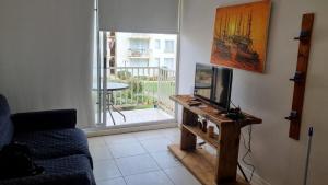 TV a/nebo společenská místnost v ubytování Condominio Bordemar Las Cruces