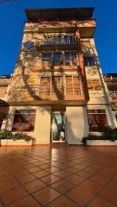 a tall building with a lot of windows at Hotel Cristal Plaza in Popayan