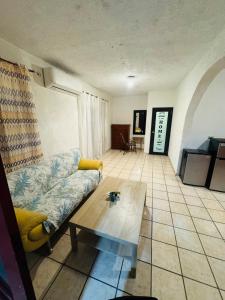 a living room with a couch and a coffee table at Tulli Private house in San Juan in San Juan