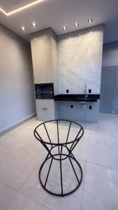 a table in the middle of a kitchen at Flat Premium bairro nobre in Imperatriz