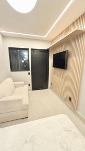 Et tv og/eller underholdning på Flat Premium bairro nobre