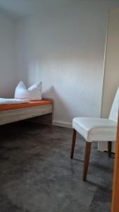 En eller flere senge i et værelse på Ferienhaus am Mühlgrundbach