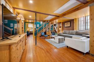 a living room with a couch and a table at St. Vincent Lofts in Los Angeles +71 photos