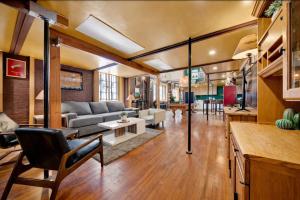 a living room with a couch and a table at St. Vincent Lofts in Los Angeles