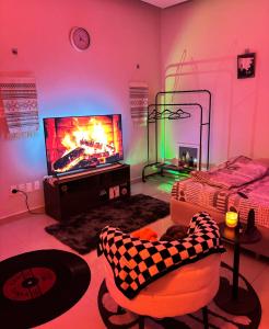 Et tv og/eller underholdning på استوديو مميز بأثاث مريح