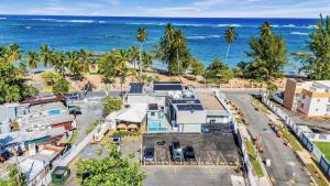 an aerial view of a street in front of the ocean at AQUA Terrazas Studio 3 - Beachfront, Pool, Local Fun & Dining in Dorado