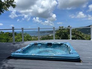 a hot tub sitting on top of a deck at CARIBBEAN SPLENDOR WITH MILLION DOLLAR VIEWS in Christiansted