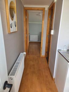 a hallway with a stairway leading to a room at Cabaña full A1 in Punta Arenas