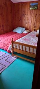 En eller flere senge i et værelse på Departamento a pasos del centro de Dalcahue