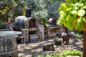 an outdoor oven with a helmet on top of it at Hyams Reach Retreat in Erowal Bay