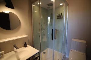 a bathroom with a shower and a sink at TAP Inn MIURA in Miura