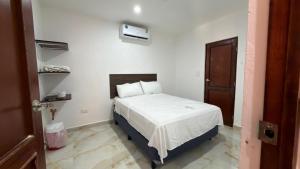 Un pat sau paturi într-o cameră la Aldea mi Casa