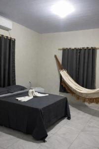 En eller flere senge i et værelse på Pousada Vale dos Buritis + 2 billeder