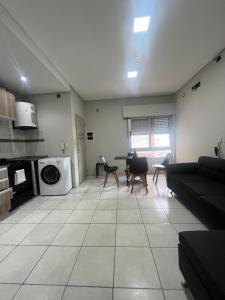 a living room with a couch and a table at SJ Apart in Corrientes