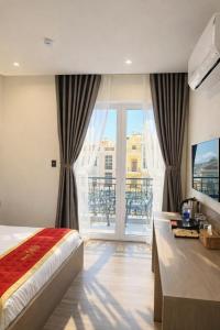 Postel nebo postele na pokoji v ubytování Hotel 168 Rạch Giá