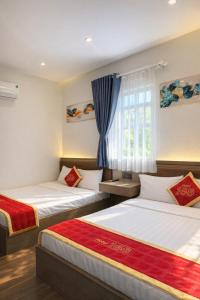 Postel nebo postele na pokoji v ubytování Hotel 168 Rạch Giá