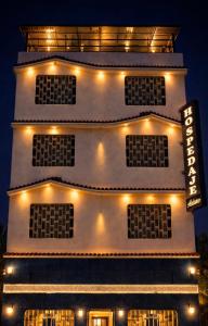 a building with lights on the side of it at Hospedaje Ariana in Supe