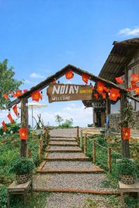 a set of stairs leading to a welcome sign at Nơi Ấy Homestay in Bắc Yên +59 photos