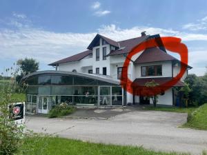 a building with an orange object on the side of it at Tona - Miran apartman - Parking - Samostalna prijava in Karlovac