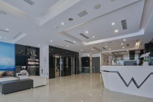a lobby of a store with a reception counter at Wecan Hotel in Kaohsiung +1 photo